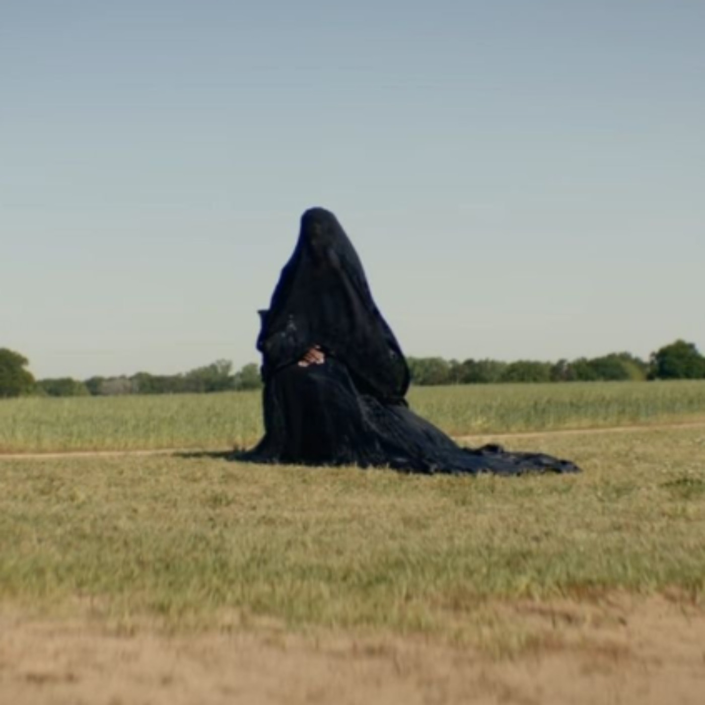 All Hail the Haunting Woman Draped in a Black Dress