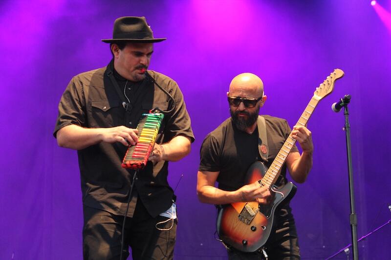 Thumbnail for "90: A Conversation With Ozomatli's Raúl Pacheco & Ulises Bella". Thumbnail for "90: A Conversation With Ozomatli's Raúl Pacheco & Ulises Bella".